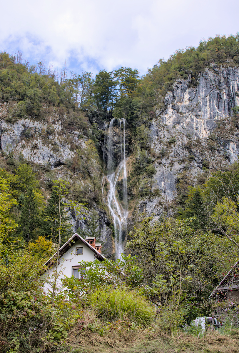 waterfall behind house